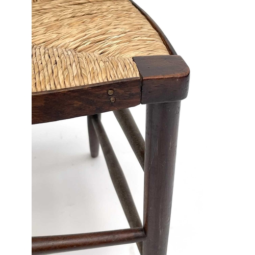 3201 - A walnut rush seated chair, early 20th century, in the Goodwin style, with spindle back.