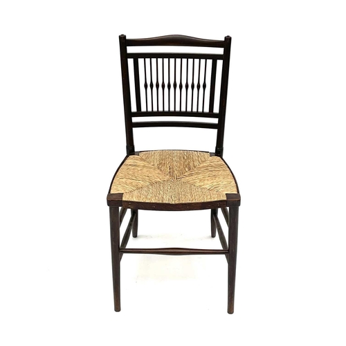 3201 - A walnut rush seated chair, early 20th century, in the Goodwin style, with spindle back.