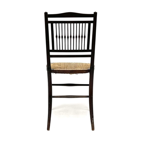 3201 - A walnut rush seated chair, early 20th century, in the Goodwin style, with spindle back.