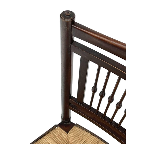 3201 - A walnut rush seated chair, early 20th century, in the Goodwin style, with spindle back.