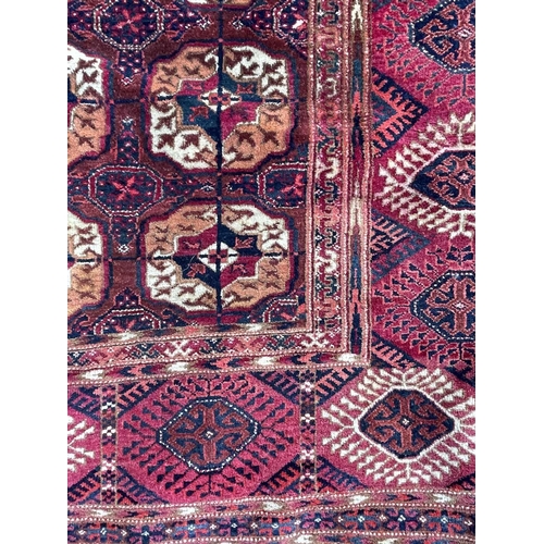 3203 - A Tekke Bokhara carpet, circa 1900-1920, with fourteen rows of five octagonal medallions, secondary ... 