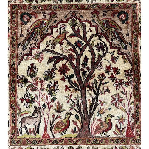 3204 - A Persian silk rug, circa 1930-1950, the ivory field with birds, trees and animal, within a similar ... 