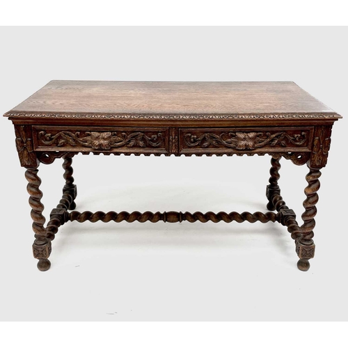 3205 - A Victorian carved oak library or centre table, fitted with two carved front drawers and raised on t... 