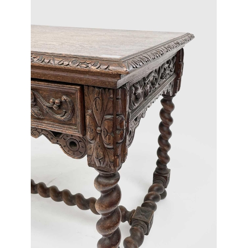 3205 - A Victorian carved oak library or centre table, fitted with two carved front drawers and raised on t... 