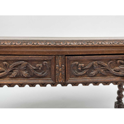 3205 - A Victorian carved oak library or centre table, fitted with two carved front drawers and raised on t... 