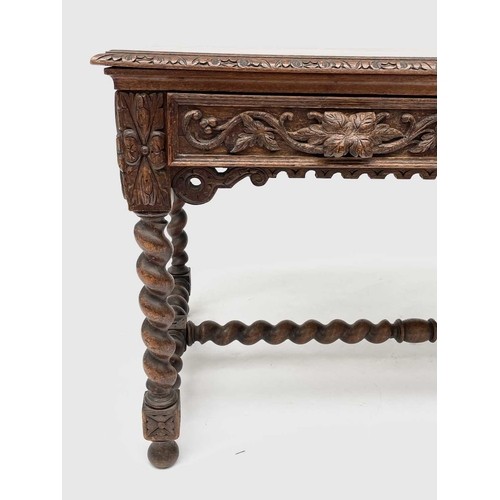 3205 - A Victorian carved oak library or centre table, fitted with two carved front drawers and raised on t... 