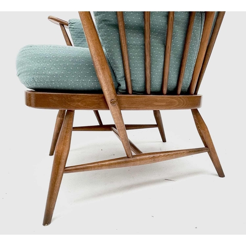 3208 - An Ercol beech and elm armchair, with upholstered loose cushions, height 104cm, width 76cm, depth 78... 