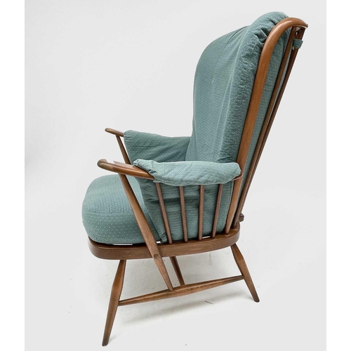 3208 - An Ercol beech and elm armchair, with upholstered loose cushions, height 104cm, width 76cm, depth 78... 