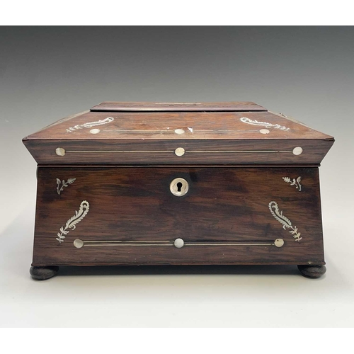 321 - A Regency rosewood and mother of pearl inlaid tea caddy, fitted with two lidded compartments, width ... 