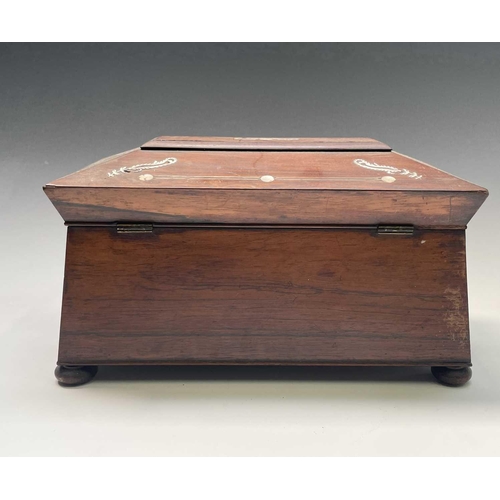 321 - A Regency rosewood and mother of pearl inlaid tea caddy, fitted with two lidded compartments, width ... 