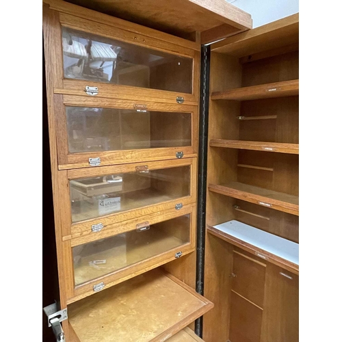 3221 - An oak veneered 1930s patent Compactum wardrobe, with typical well fitted interior, with compartment... 