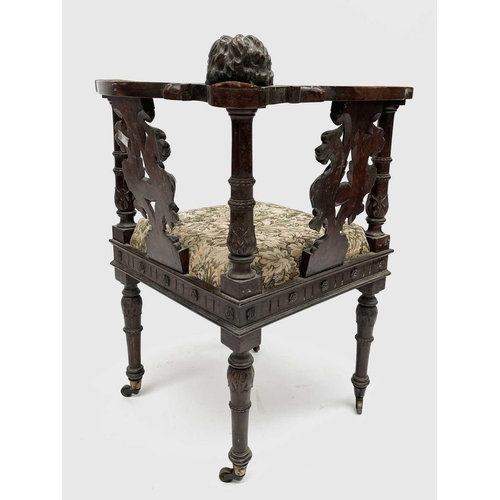 3223 - An Italian Renaissance carved oak corner chair, 19th century, the top rail carved with a cherubs mas... 