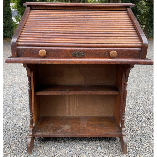 3225 - An oak roll top desk, height 101cm, width 72cm, depth 50cm.