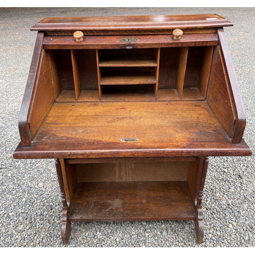 3225 - An oak roll top desk, height 101cm, width 72cm, depth 50cm.