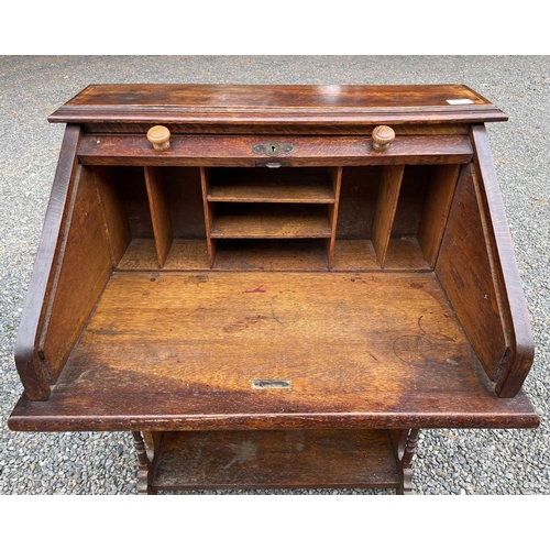 3225 - An oak roll top desk, height 101cm, width 72cm, depth 50cm.