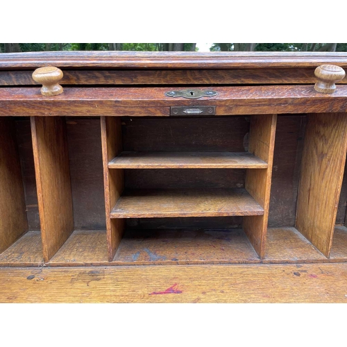 3225 - An oak roll top desk, height 101cm, width 72cm, depth 50cm.