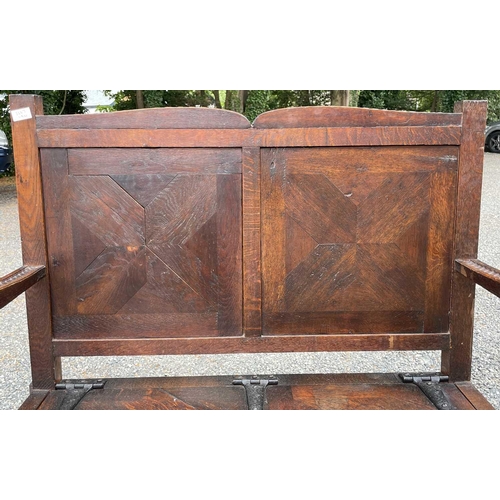 3227 - An Arts and Crafts oak bench, height 109c, width 104cm, depth 52cm.