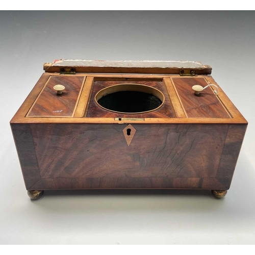 323 - A late George III mahogany and crossbanded tea caddy, with two lidded compartments, width 29cm, toge... 