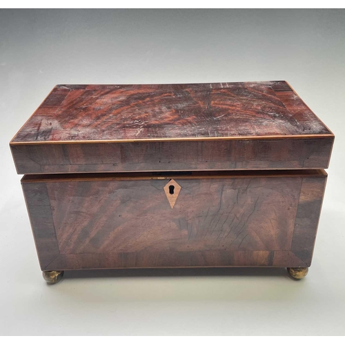 323 - A late George III mahogany and crossbanded tea caddy, with two lidded compartments, width 29cm, toge... 