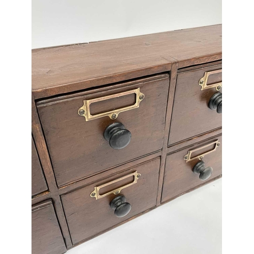 327 - A bank of Victorian stained pine apothecary drawers with turned ebonised handles. Height 31cm, width... 