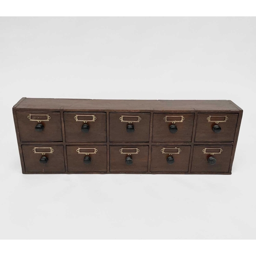 327 - A bank of Victorian stained pine apothecary drawers with turned ebonised handles. Height 31cm, width... 