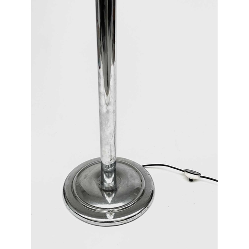 332 - A chrome standard lamp, later 20th century, with flexible upper stem, dished shade and circular base... 