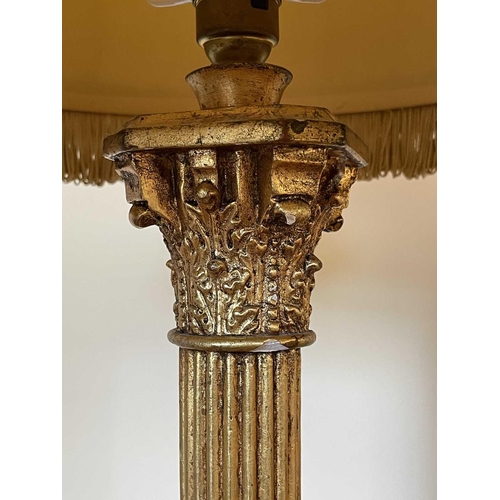 336 - A gilt plaster Corinthian column table lamp with gold brocade shade, overall height 78cm.