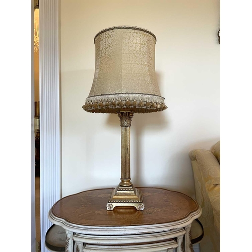 336 - A gilt plaster Corinthian column table lamp with gold brocade shade, overall height 78cm.