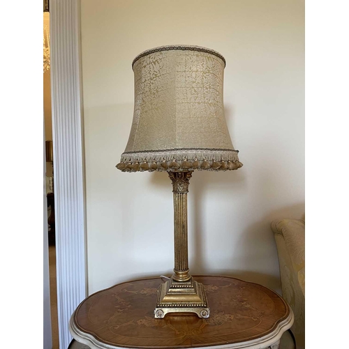 336 - A gilt plaster Corinthian column table lamp with gold brocade shade, overall height 78cm.