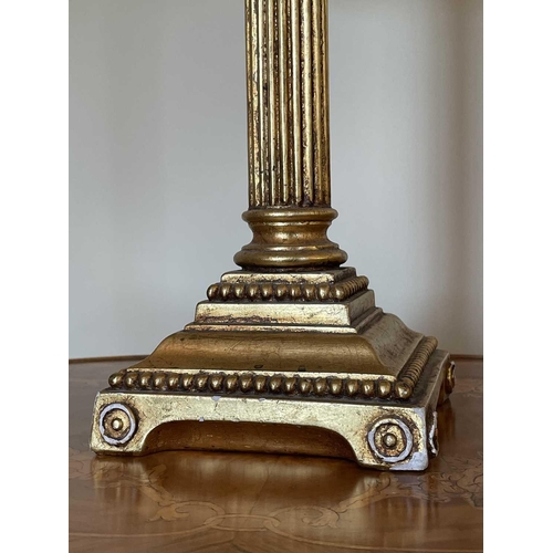 336 - A gilt plaster Corinthian column table lamp with gold brocade shade, overall height 78cm.