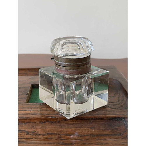 342 - An oak deskstand, circa 1920's, fitted with two glass inkwells, width 26cm.