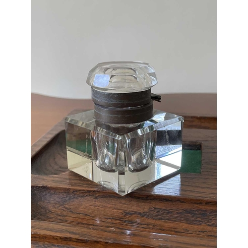 342 - An oak deskstand, circa 1920's, fitted with two glass inkwells, width 26cm.