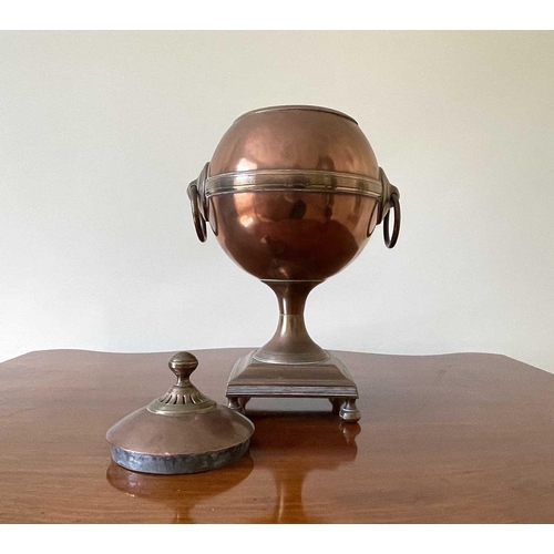 343 - A Regency copper and brass tea urn, of spherical form on a square base, height 32cm.