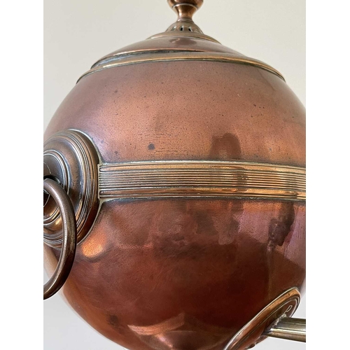 343 - A Regency copper and brass tea urn, of spherical form on a square base, height 32cm.