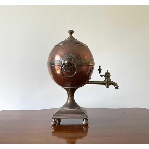 343 - A Regency copper and brass tea urn, of spherical form on a square base, height 32cm.