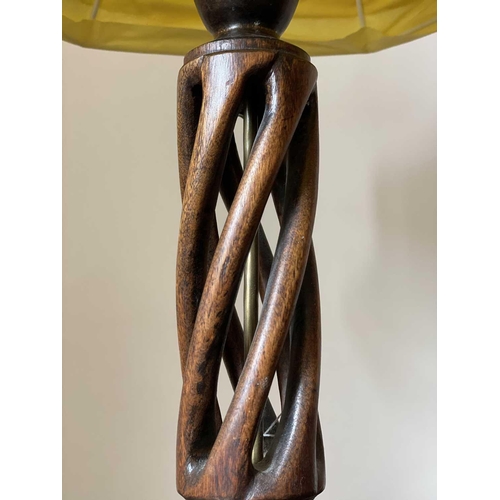 348 - A 1930's oak table lamp, with open spiral work stem, total height 75cm.