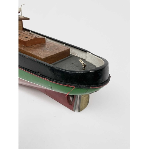 354 - A 20th century model of a steam boat, the hull painted in green and red. Overall length 110cm.