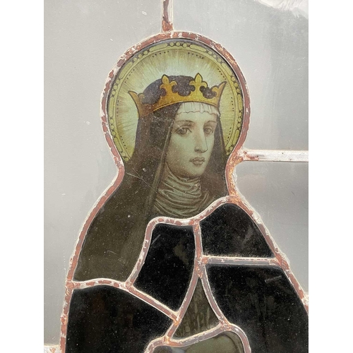 356 - A 19th century stained glass panel depicting a female figure holding a scroll 'Vexilla regis', set w... 