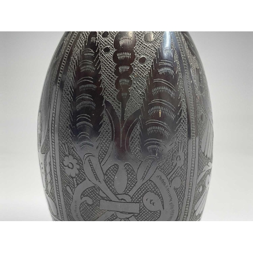 366 - An elaborately carved African nut, height 11.5cm, together with two carved alabaster scarab beetles,... 