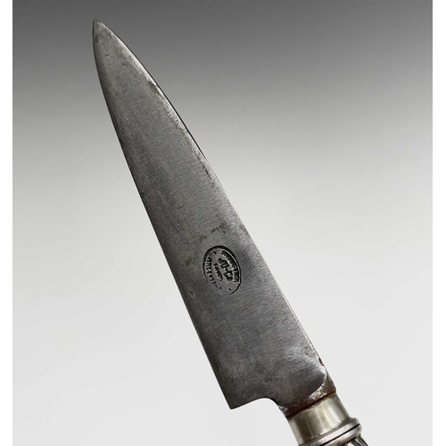 37 - An Argentinian gaucho knife, mid 20th century, with spiral white metal grip and similarly decorated ... 