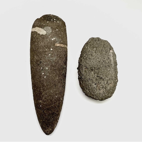 38 - A Neolithic stone axe head, reputedly found in West Penwith, length 21cm, together with another text... 