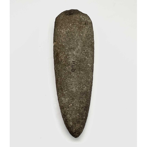 38 - A Neolithic stone axe head, reputedly found in West Penwith, length 21cm, together with another text... 