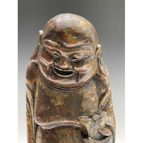 381 - A Chinese carved bamboo figure of Buddha, height 39cm, together with a Sri Lankan papier-mache noddi... 