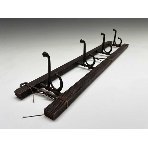 383 - An Edwardian reeded oak coat rack, fitted with four folding steel hooks, width 55cm, together with a... 