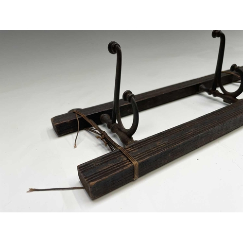 383 - An Edwardian reeded oak coat rack, fitted with four folding steel hooks, width 55cm, together with a... 