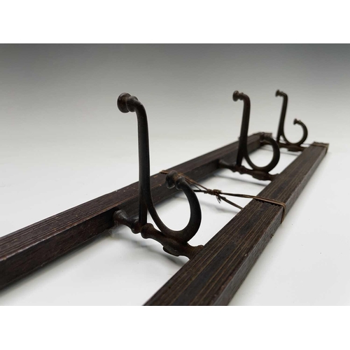 383 - An Edwardian reeded oak coat rack, fitted with four folding steel hooks, width 55cm, together with a... 