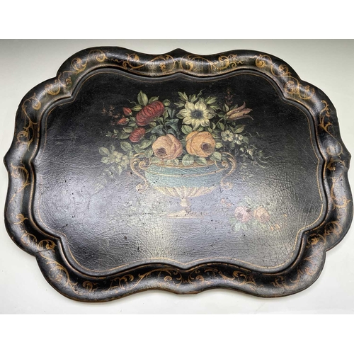 384 - A 19th century papier-mache tray, painted with a flower filled urn, 60X77cm.