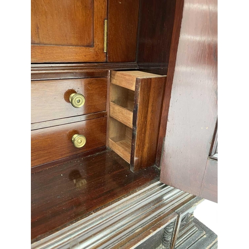 385 - An Edwardian mahogany humidor fitted with a bevelled edge glazed door, with fitted interior and a fu... 