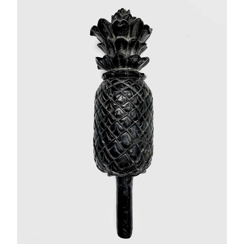 389 - A carved ebony pineapple finial, probably 18th century, height 31cm.