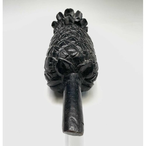 389 - A carved ebony pineapple finial, probably 18th century, height 31cm.